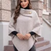 capa-asimetrica-din-tricot-pufos-cu-guler-amplu-si-brosa