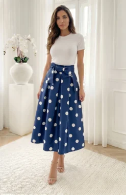 Fusta midi bleumarin cu buline albe si funda in talie