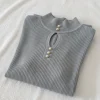 pulover-gri-elegant-cu-nasturi-perlati-si-decupaj-oval