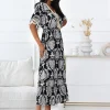 rochie-lunga-neagra-cu-imprimeu-alb-si-ciucuri-decorative