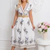 rochie-midi-alba-cu-broderie-decolteu-in-v-si-curea-textila