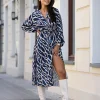 rochie-midi-albastra-cu-imprimeu-animal-si-decolteu-petrecut