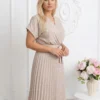rochie-midi-bej-plisata-cu-buline-albe-si-decolteu-petrecut