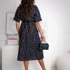 rochie-neagra-midi-cu-buline-albe-si-crapatura-laterala