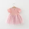 rochie-roz-cu-fusta-din-tul-si-floare-decorativa
