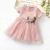 rochie-roz-cu-fusta-din-tul-si-floare-decorativa