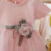 rochie-roz-cu-fusta-din-tul-si-floare-decorativa